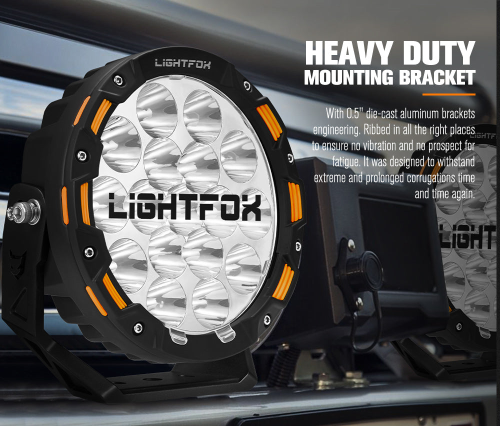 Heavy-duty Lightfox off-road light with mounting bracket on a vehicle.